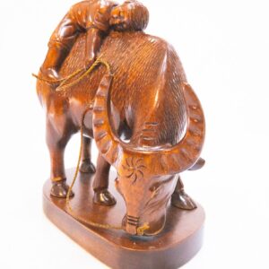 Boy on Carabao Wooden Statue